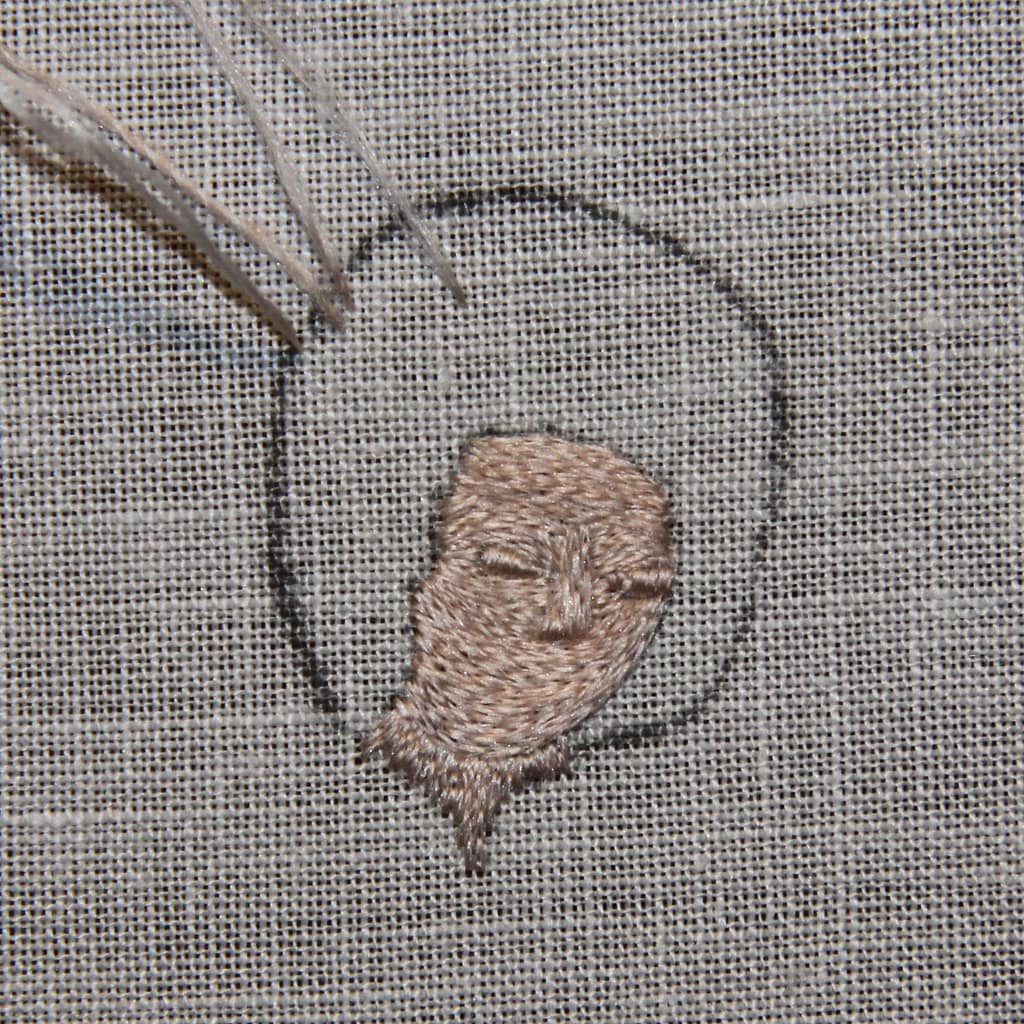 Embroidery Tutorial - partly finished sample of a female embroidered head