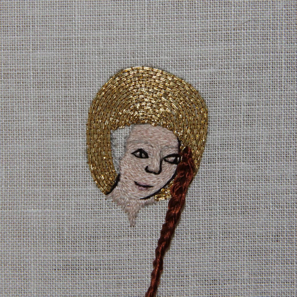Embroidery Tutorial - partly finished sample of a female embroidered head