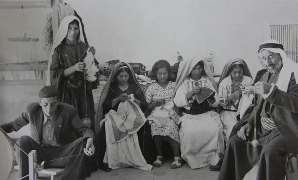 Fallahi embroidery - black and white picture of a group of people embroidering