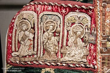 Medieval Goldwork - multi coloured embroidery of three figures.