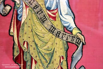 Museu Episcopal de Vic - A red antependium with goldwork embroidery displayed in a museum.