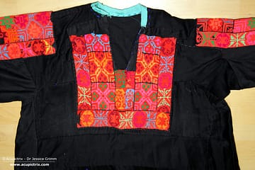 Fallahi embroidery - black Bedouin dress with colourful crossstitch embroidery