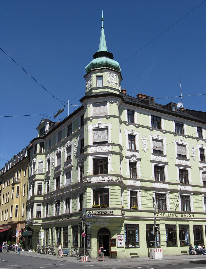 A street corner with a green vintage house in Munich.