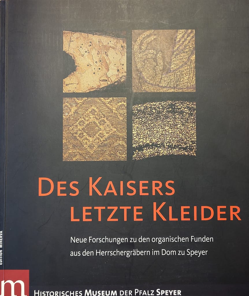 Book review - Black book band with detailed pictures of goldwork embroidery