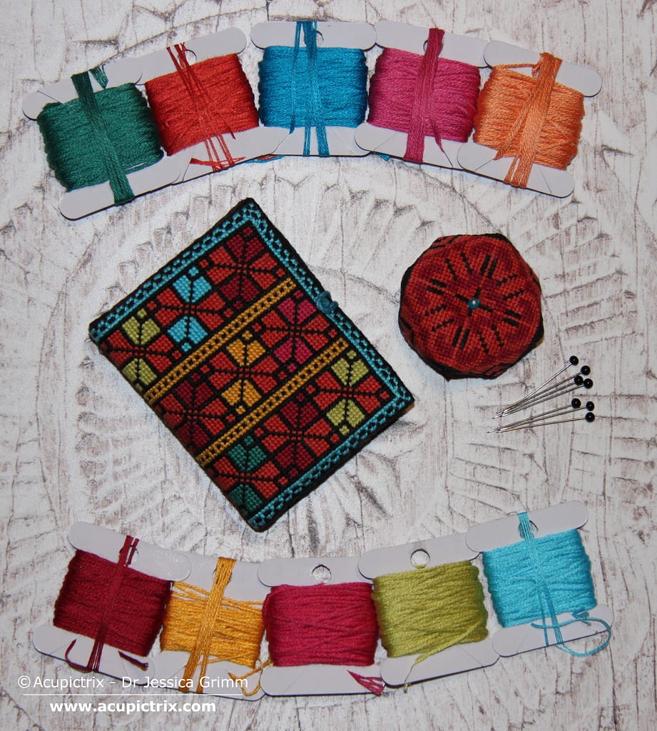 Fallahi embroidery - crossstitch patterns used on a needlebook and a pincushion